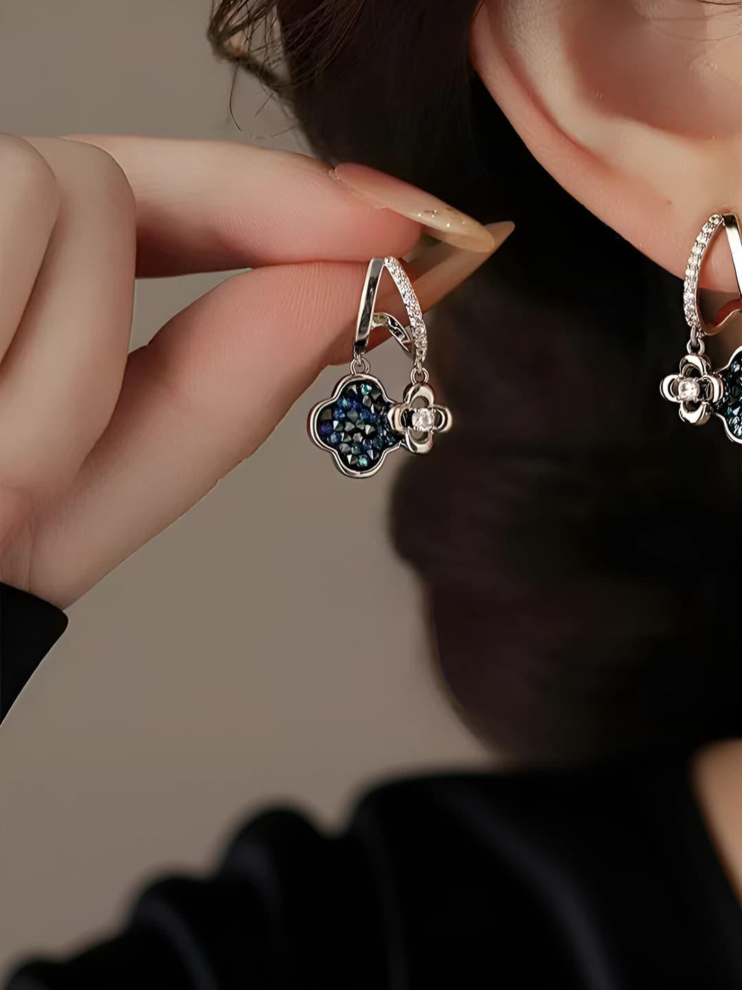 Women's earrings with floral design and crystal inlays in a light luxury style