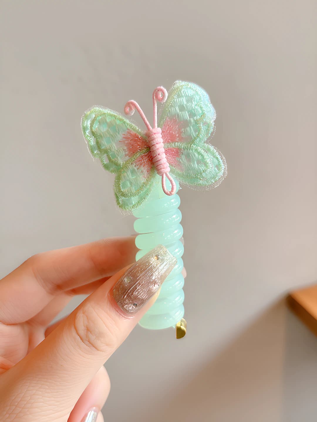 4# Green butterfly, wire hair tie