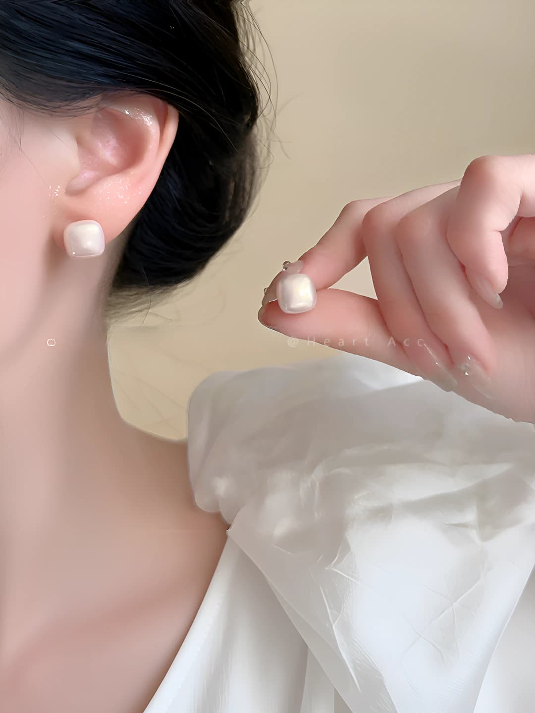 Women's white pearl stud earrings with silver posts