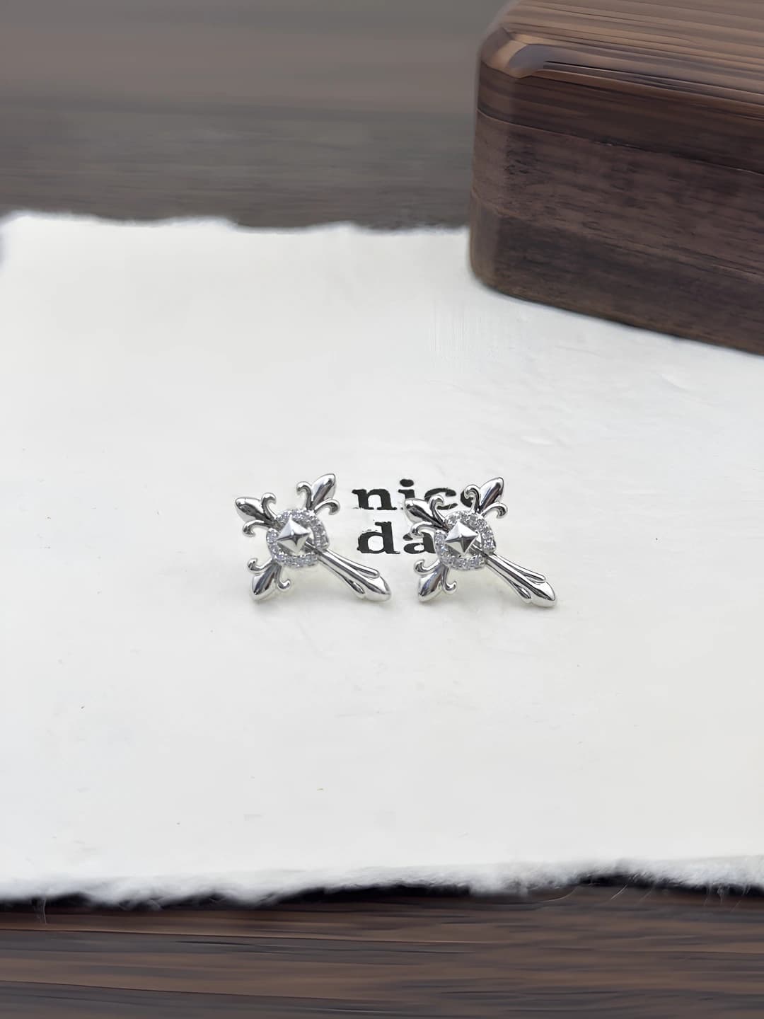 Women's 316L titanium steel stud earrings with full zirconia cross and iris design