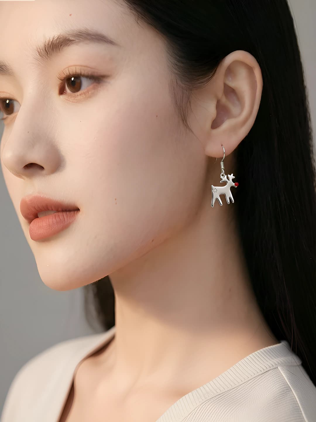 Women's boho style earrings with reindeer, snowflake and snowflake design elements