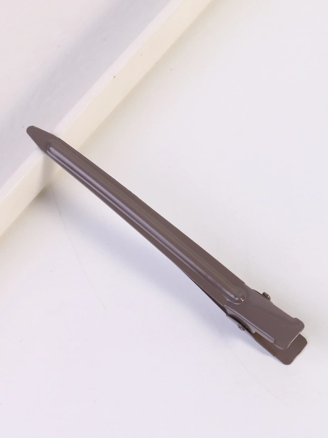 Grey-coffee pointed clip