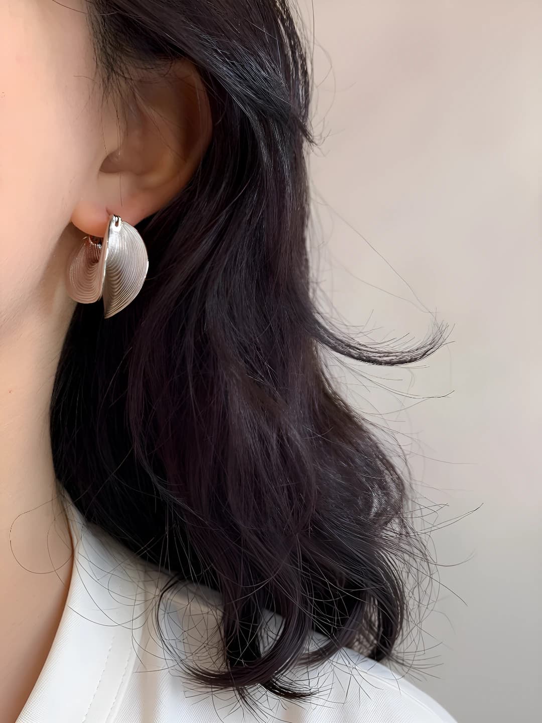 Women's silver post earrings with retro style, geometric shape and textured surface