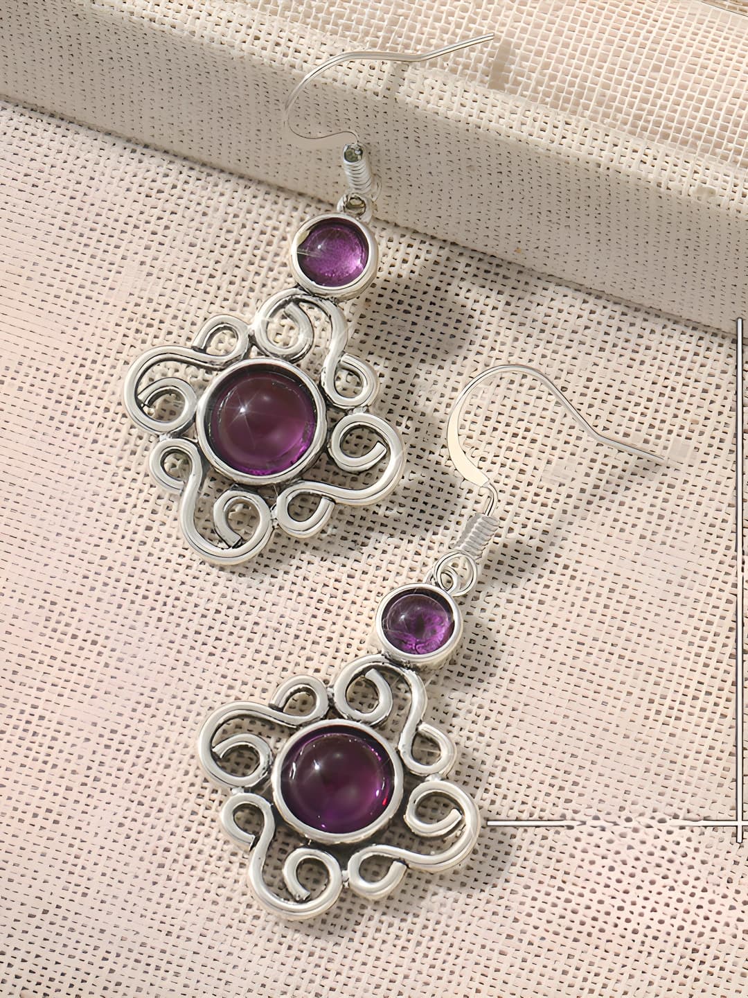 Women's copper dangle earrings with geometric design element in retro style