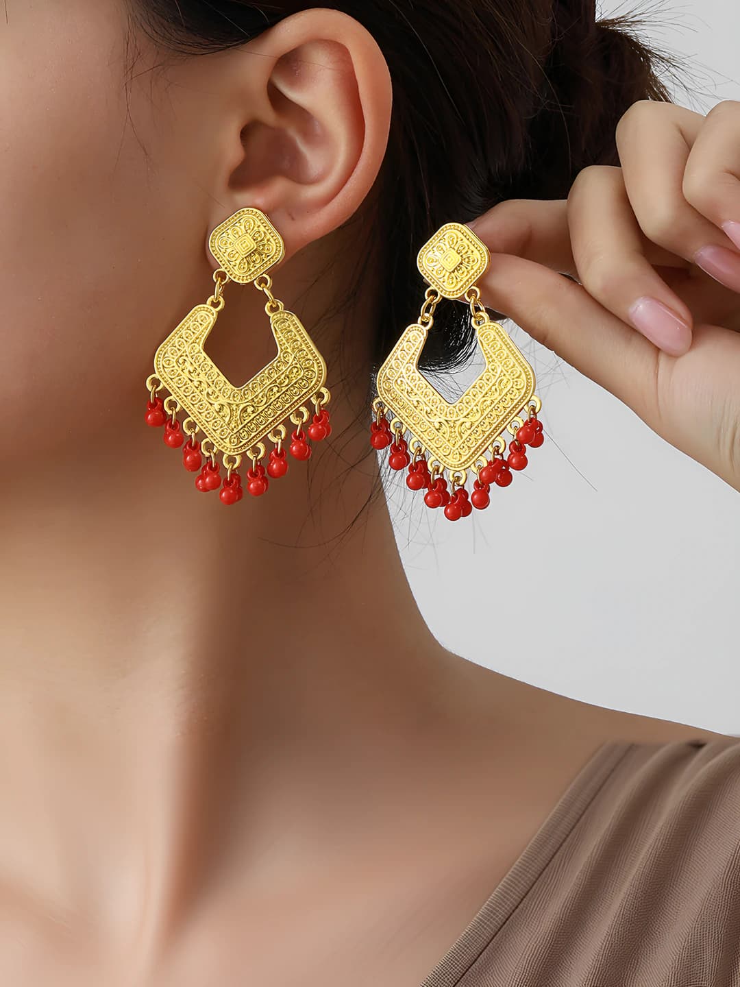 Women's retro boho style earrings with cut-out pattern, totem and tassels