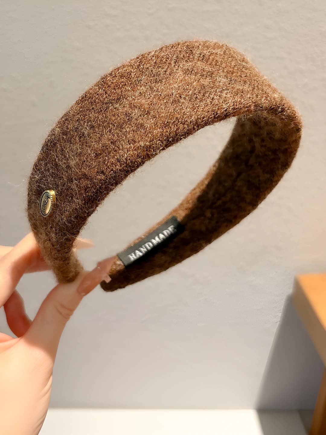 Brown felt with gold logo