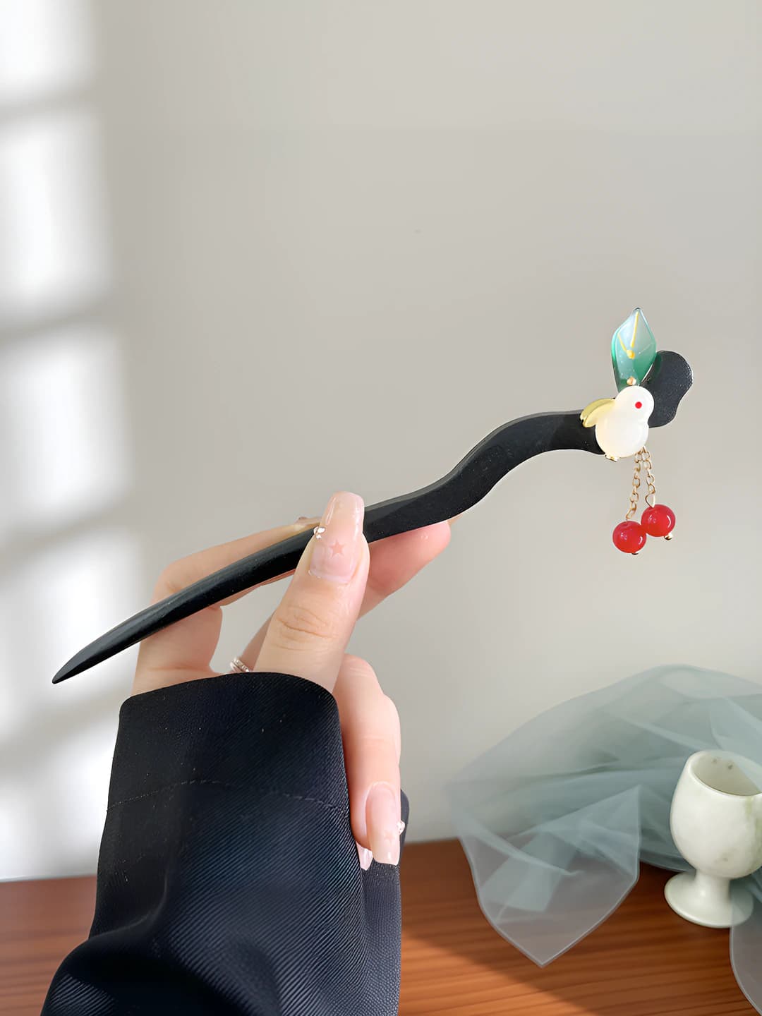 Green leaf, rabbit, red bead