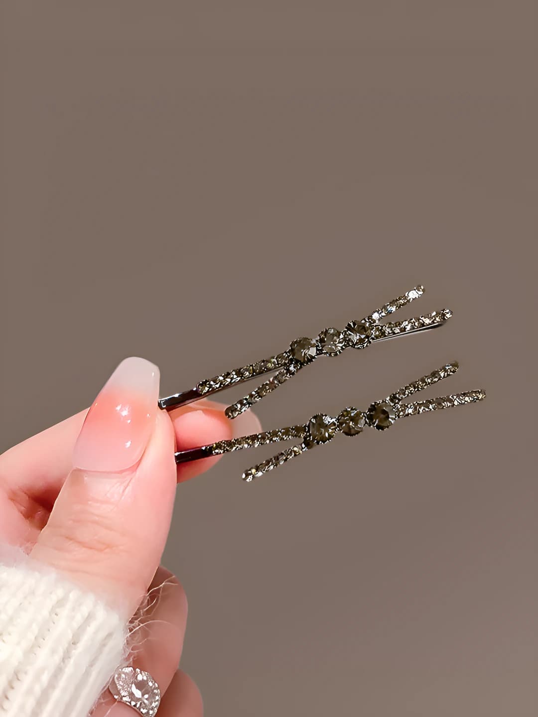 Crossed black rhinestone barrette