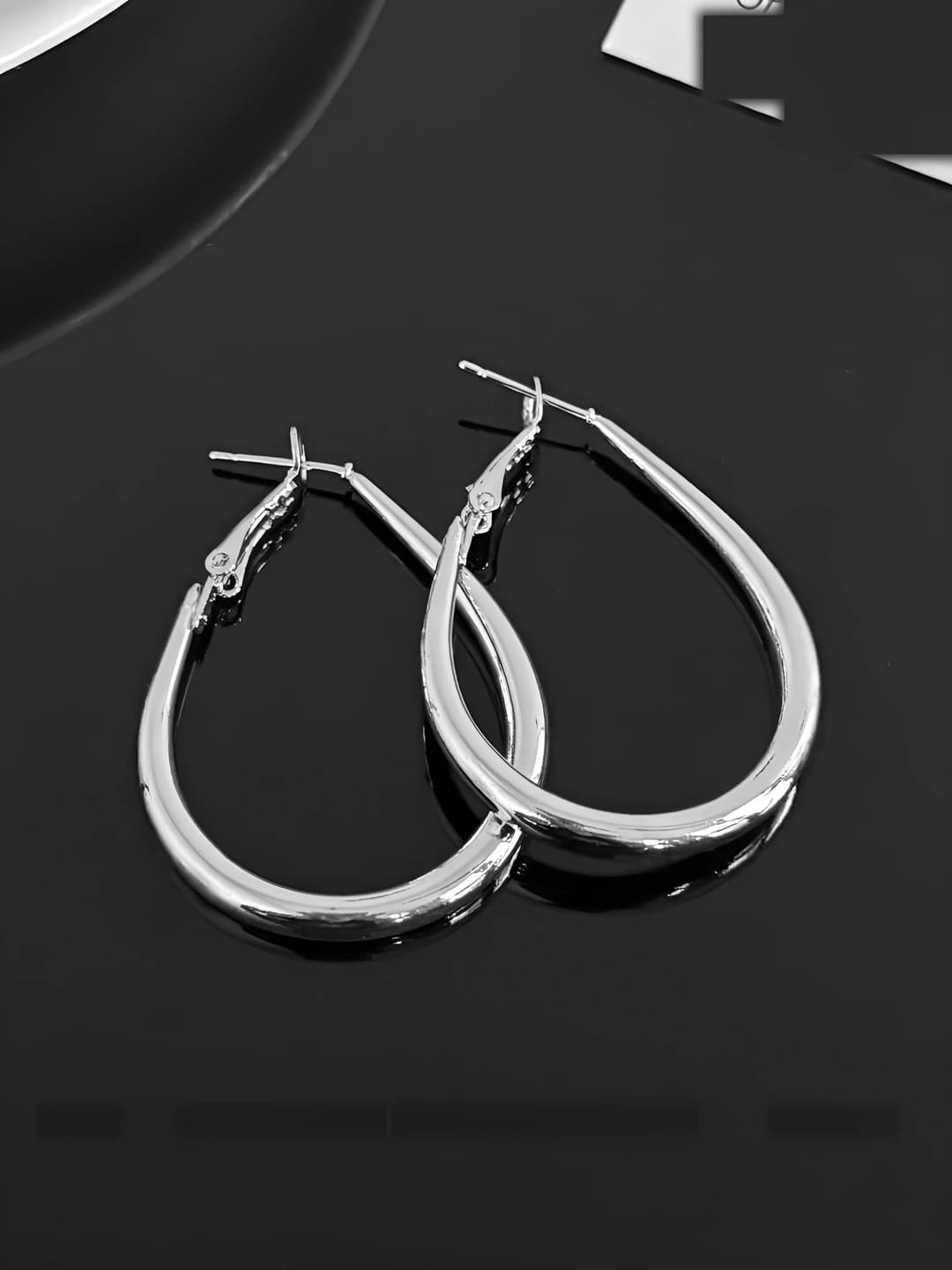 Silver teardrop hoop earrings