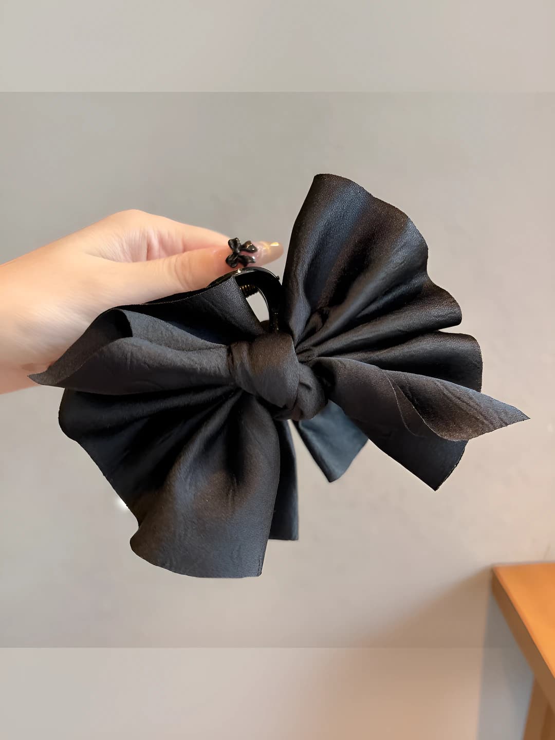 Black, multi-layer bow