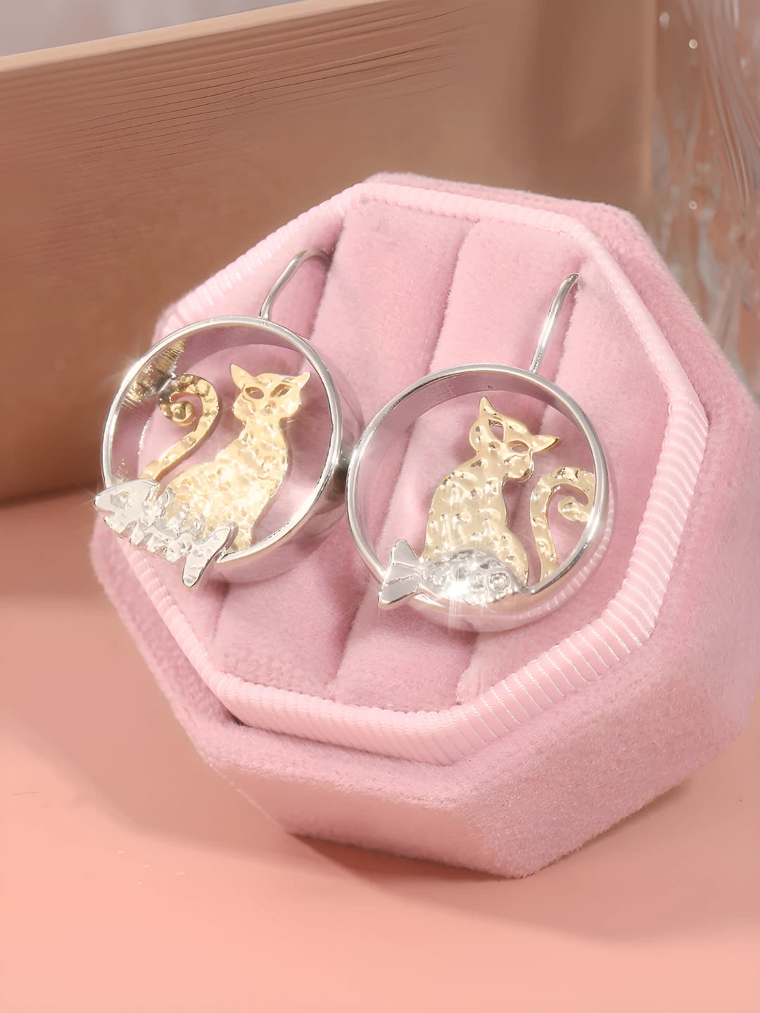 Women's retro style earrings with round design element made of copper
