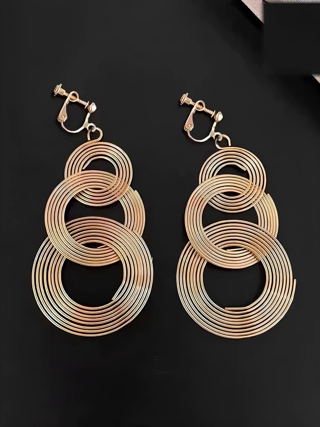 Multi-layer openwork spiral clip-ons