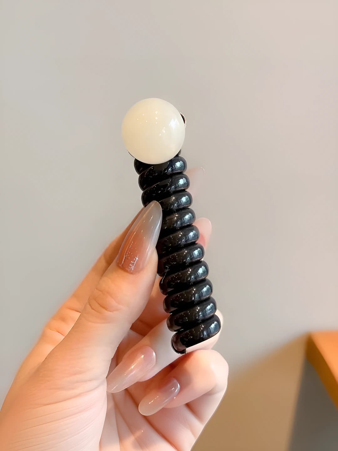 Brown, telephone cord, off-white pearls