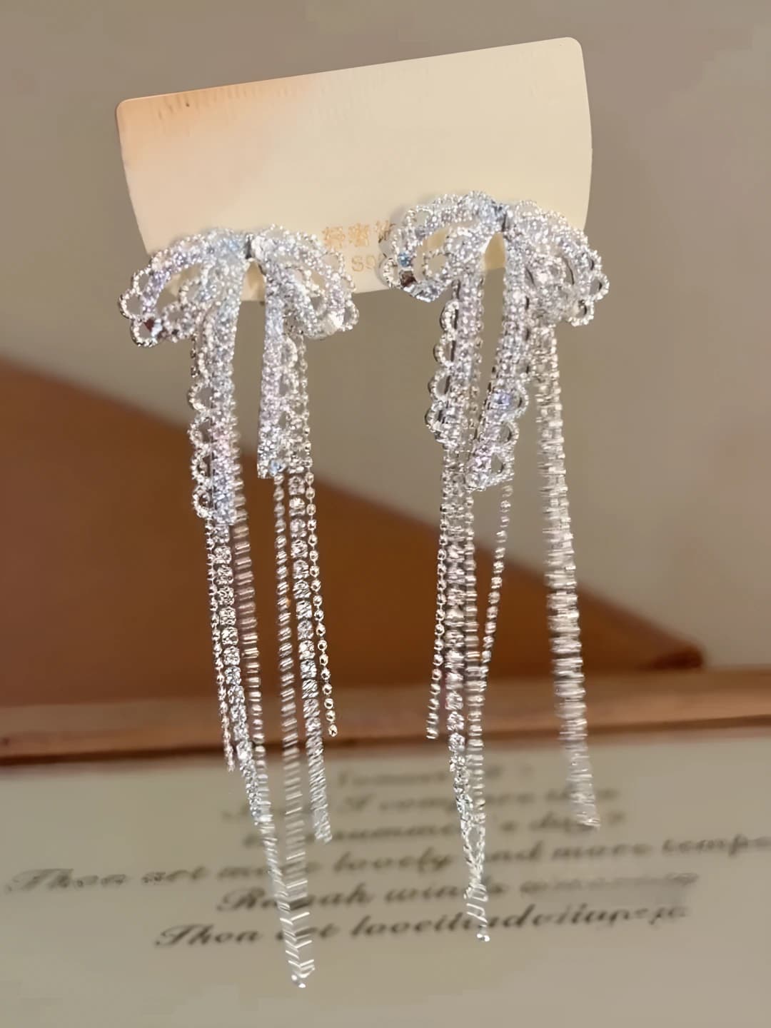 Women's French style earrings with silver post, rhinestones, bow and tassel, casual and commute style