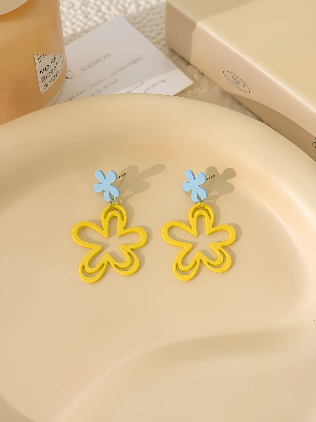 Blue yellow openwork flower studs