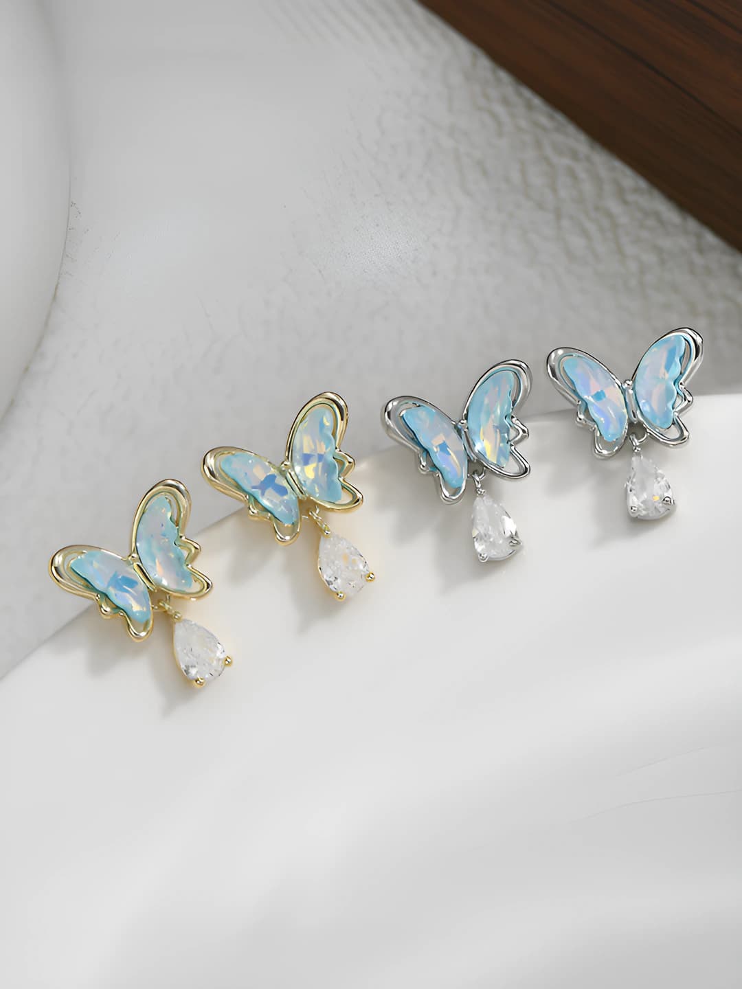 Women's butterfly drop earrings with teardrop pendants on silver posts, 2026