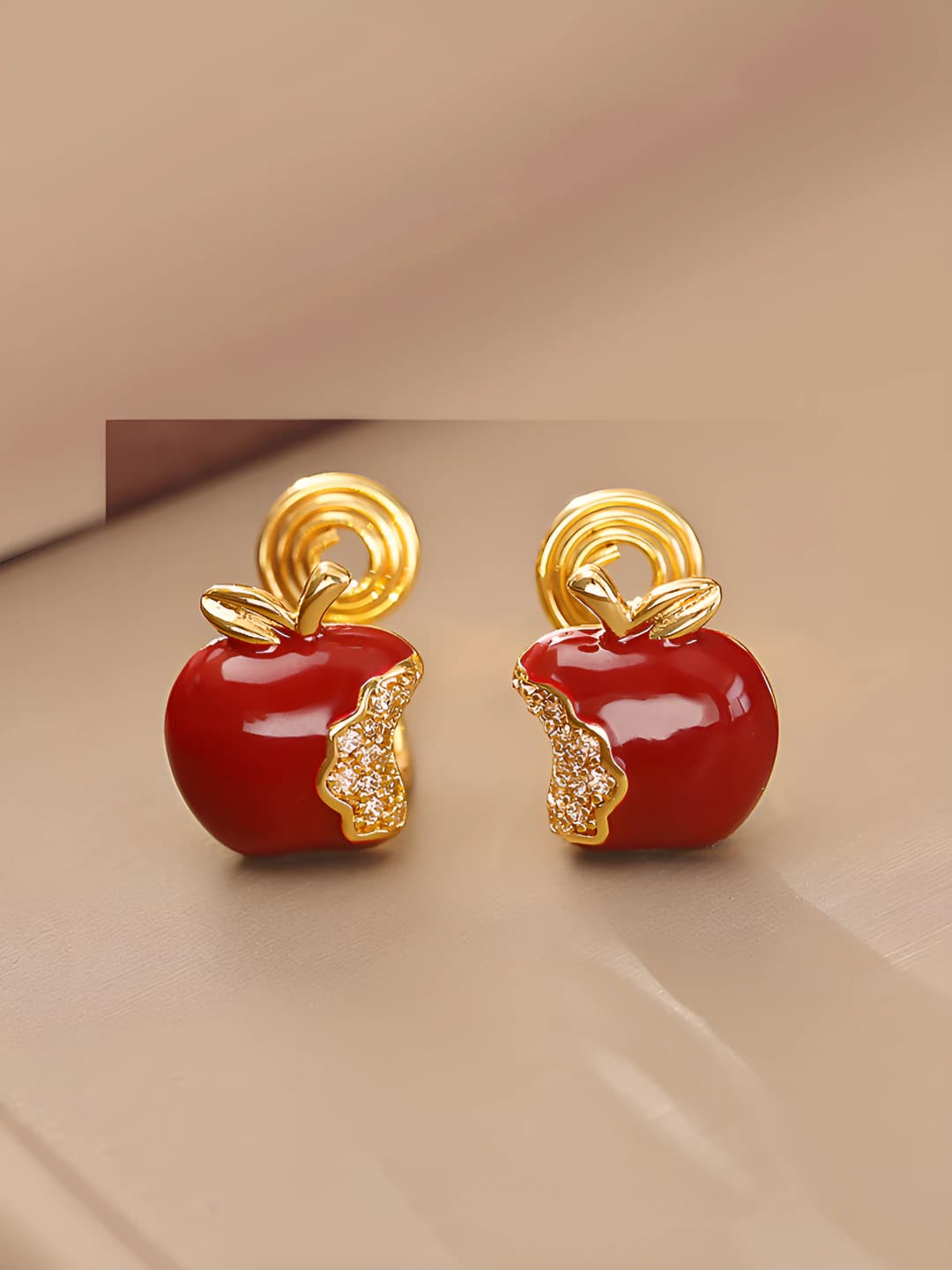 Bitten apple clip-on earrings