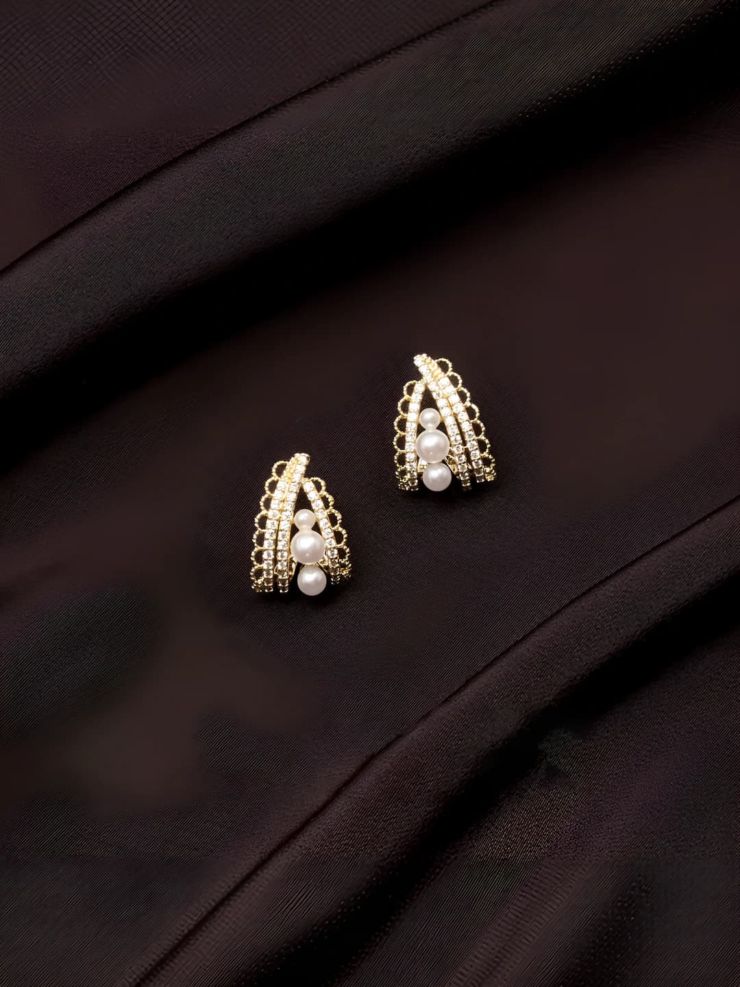 Women's gold earrings with crystals and pearls in retro style