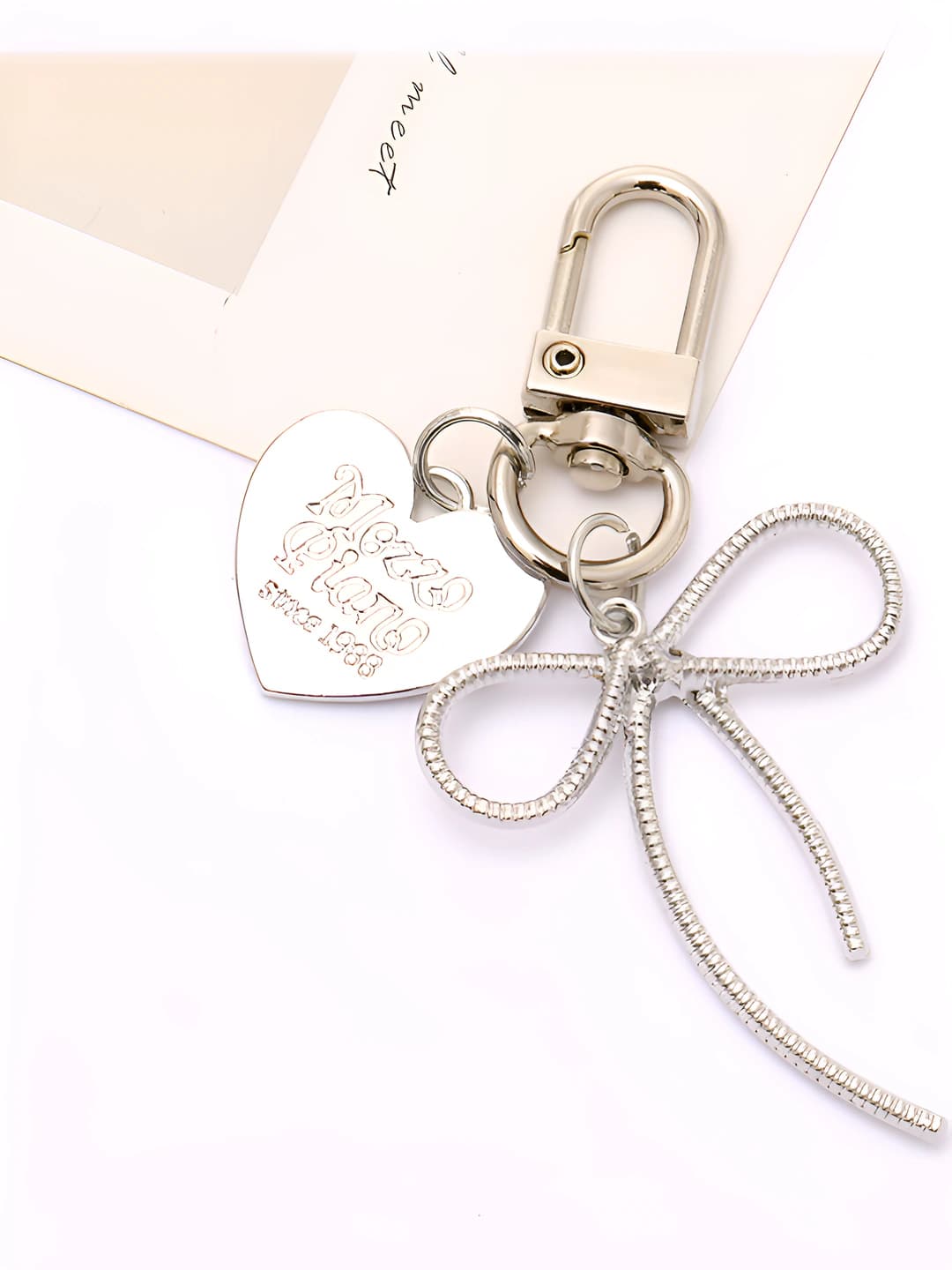 Silver bow charm