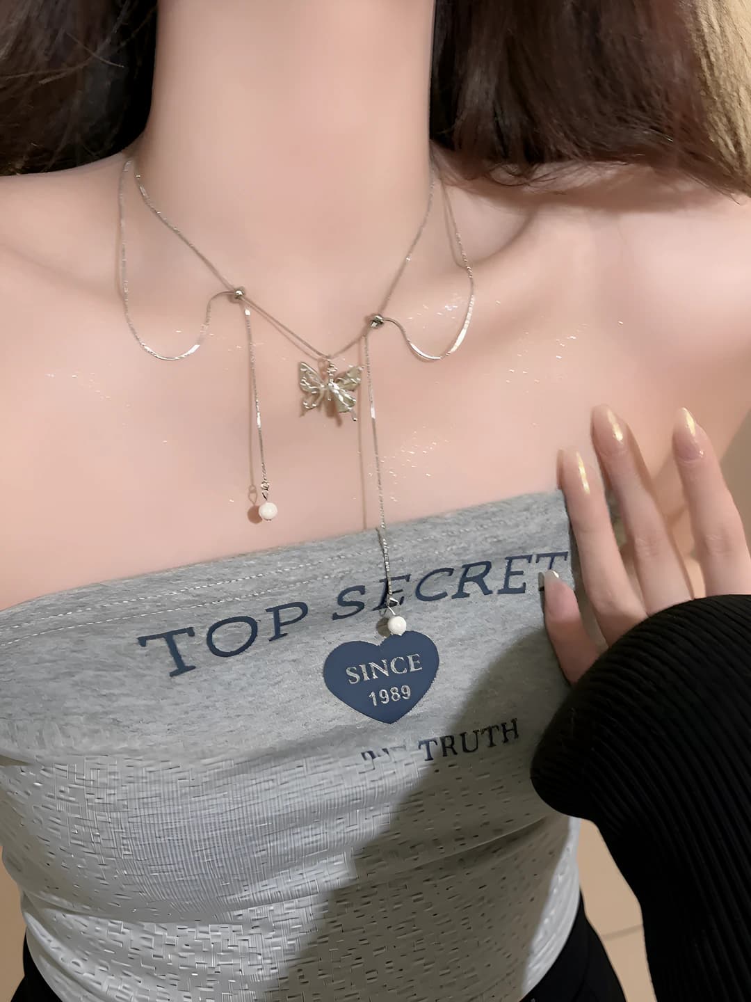 Women's silver butterfly tassel necklace with faux pearls, light luxury style, collarbone chain