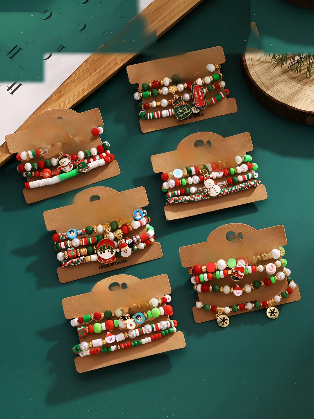 Women's stretch acrylic beaded bracelet, hand-woven, colorful, with design elements: snowflakes, bells and rhinestones