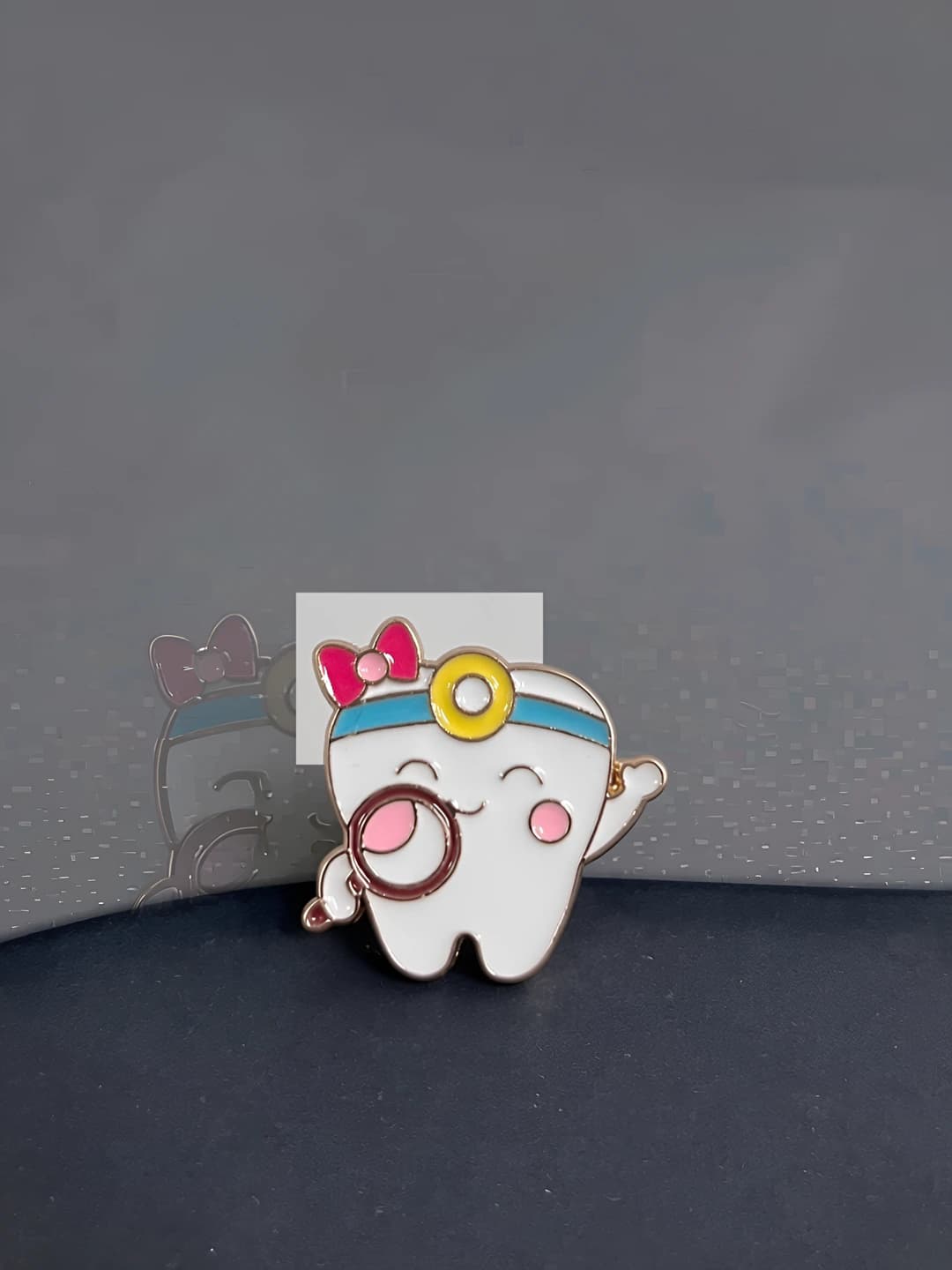 Magnifying glass brooch