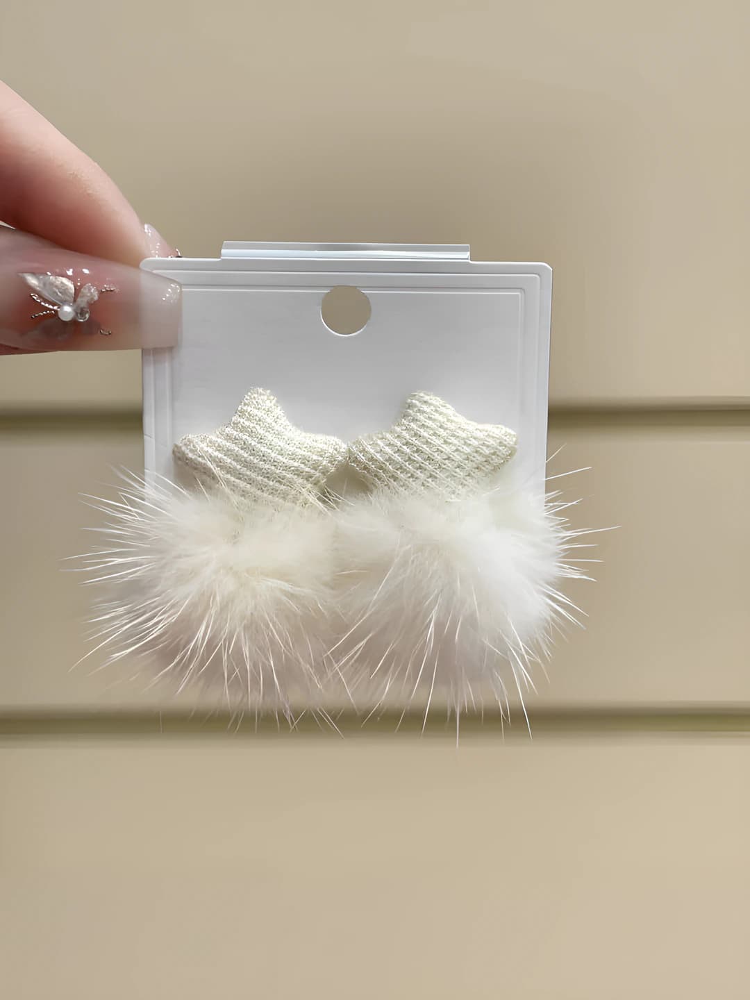 Off-white pom star earrings