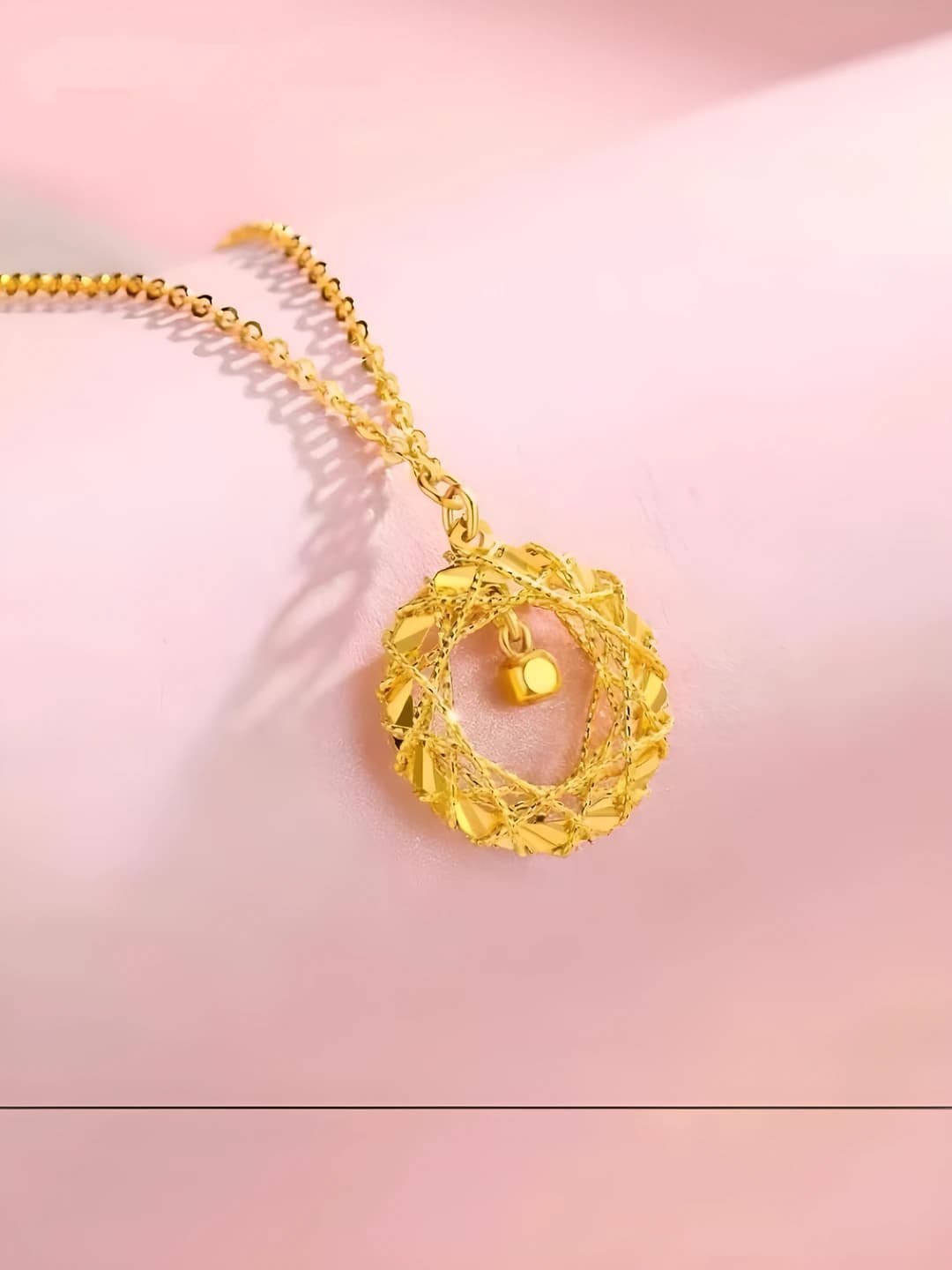 Women's pendant necklace with geometric shape and Mobius design element, brass with electroplating
