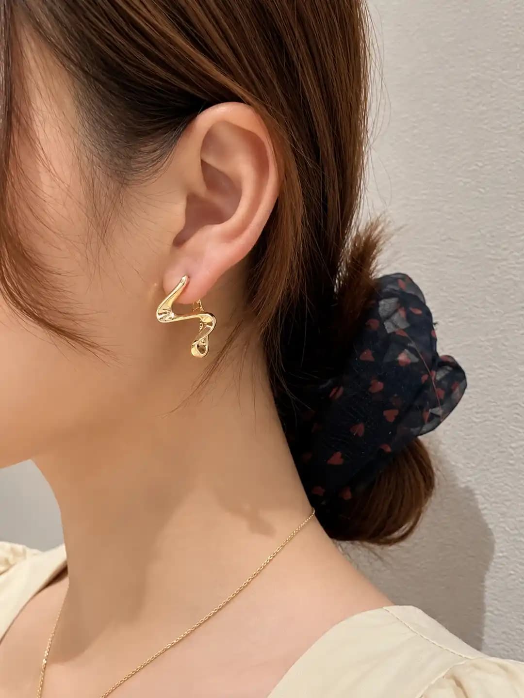 Women's metal wave earrings, minimalist style, geometric design element