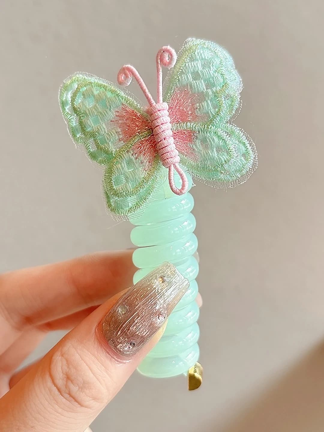 4# Green butterfly, wire hair tie