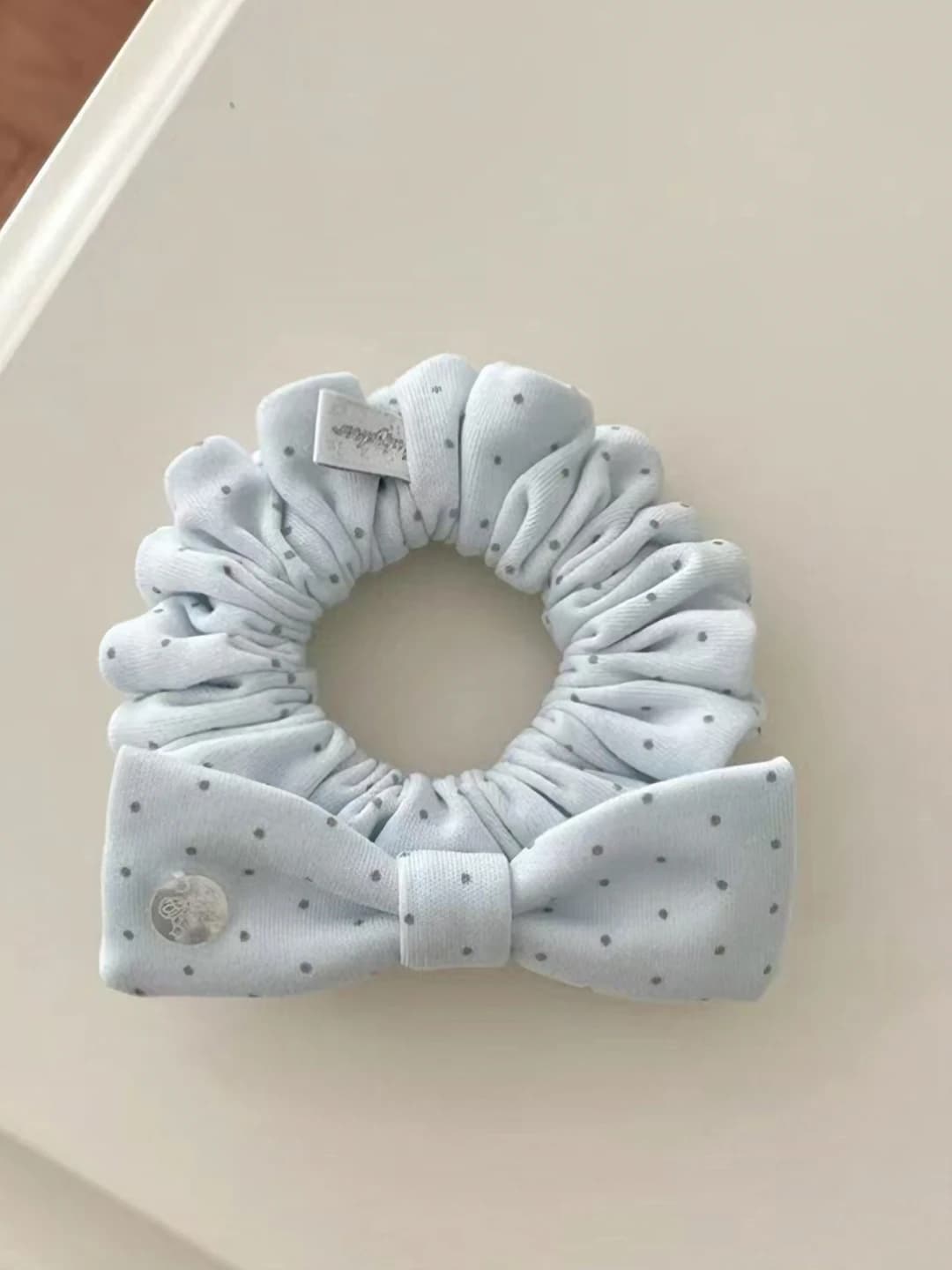 Blue polka dot scrunchie