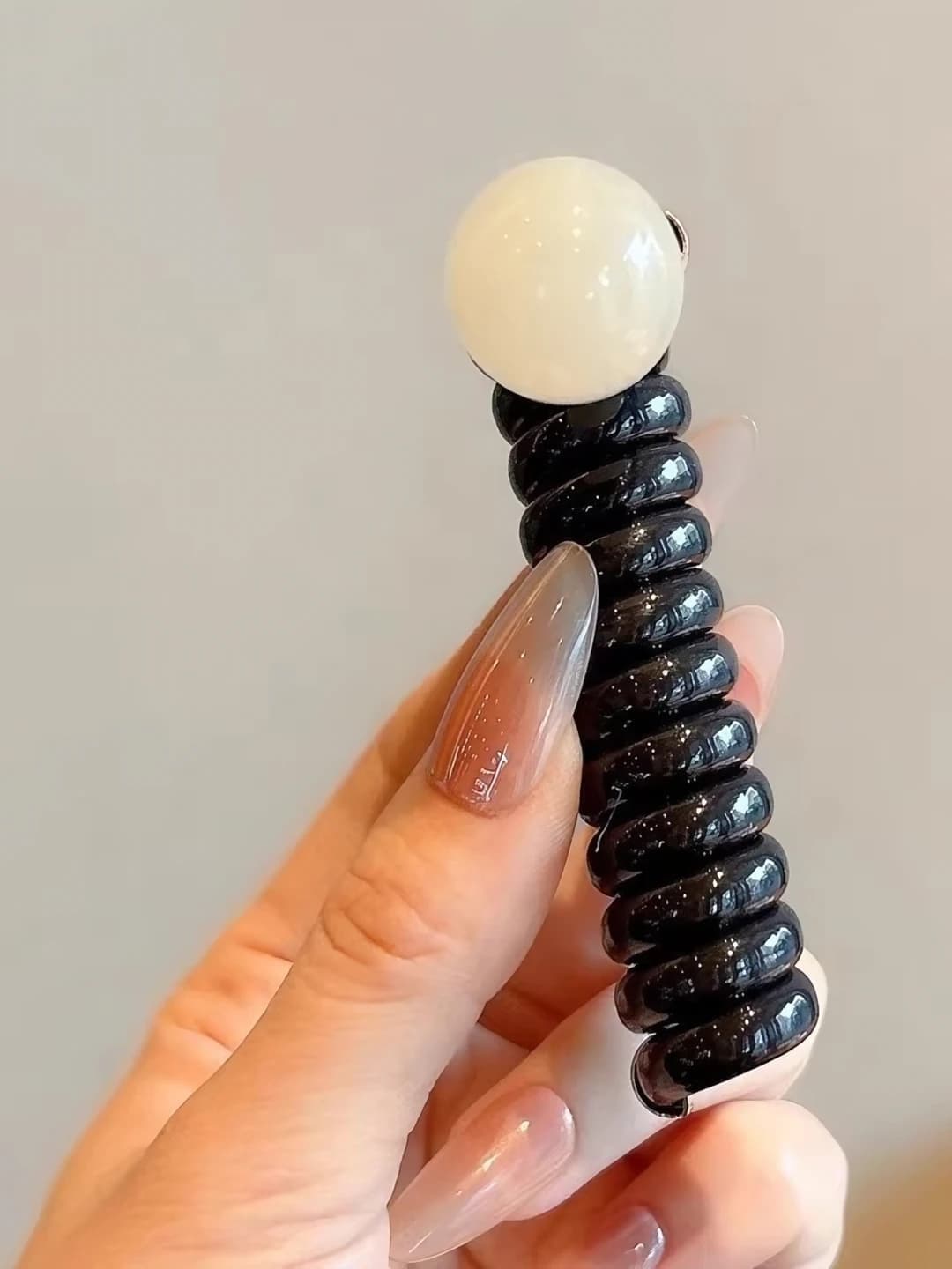 Brown, telephone cord, off-white pearls