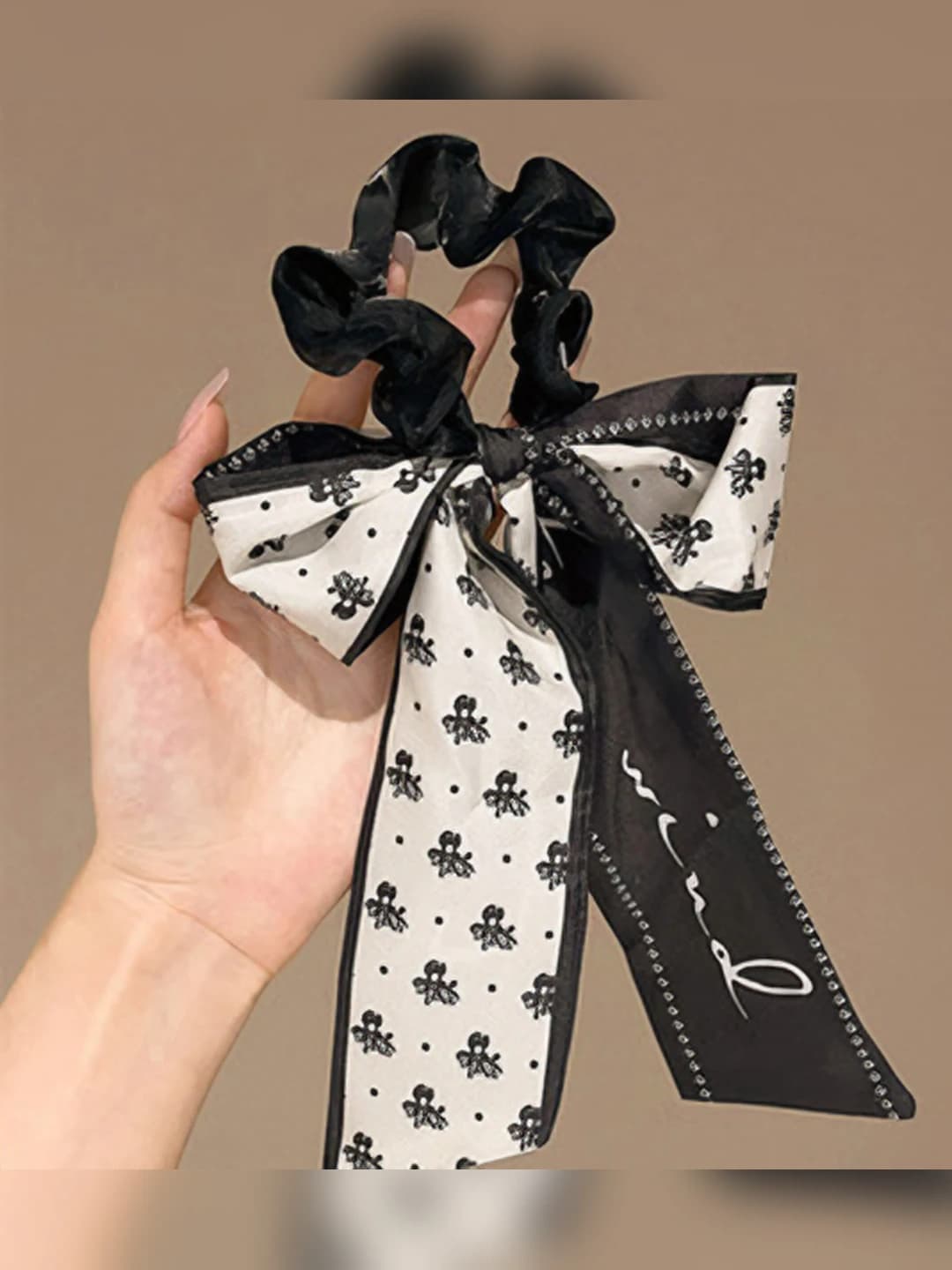 2# Premium black ring ~9 cm ribbon ~18 cm