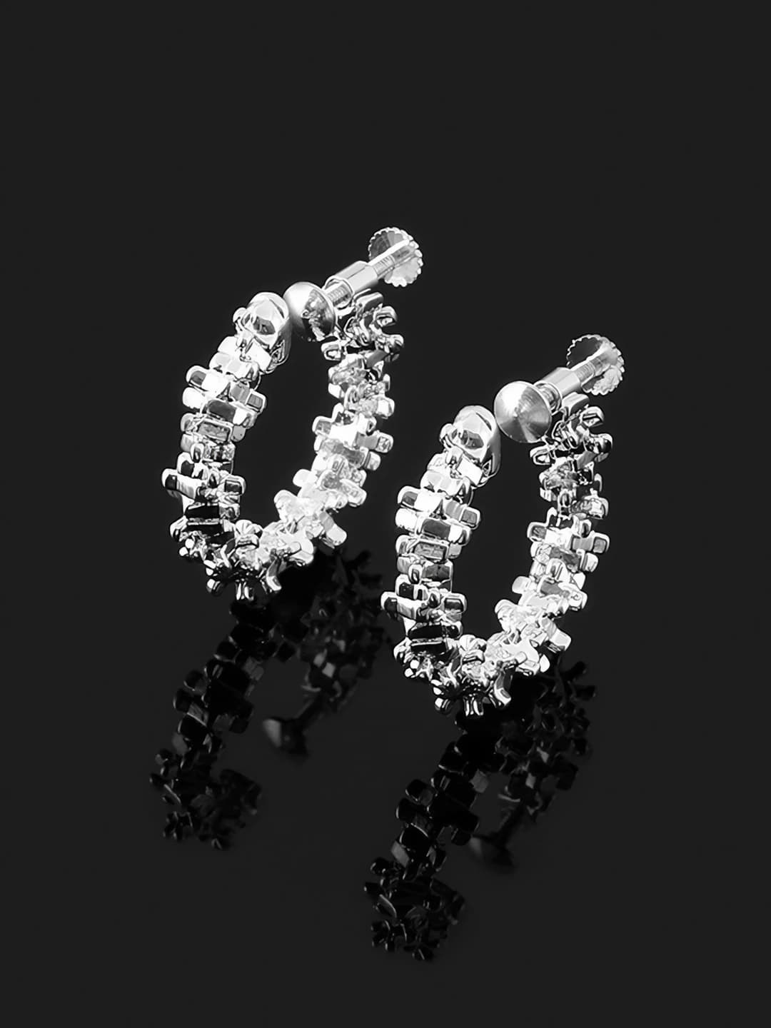 No hole. Screw-back clips. Thick silver