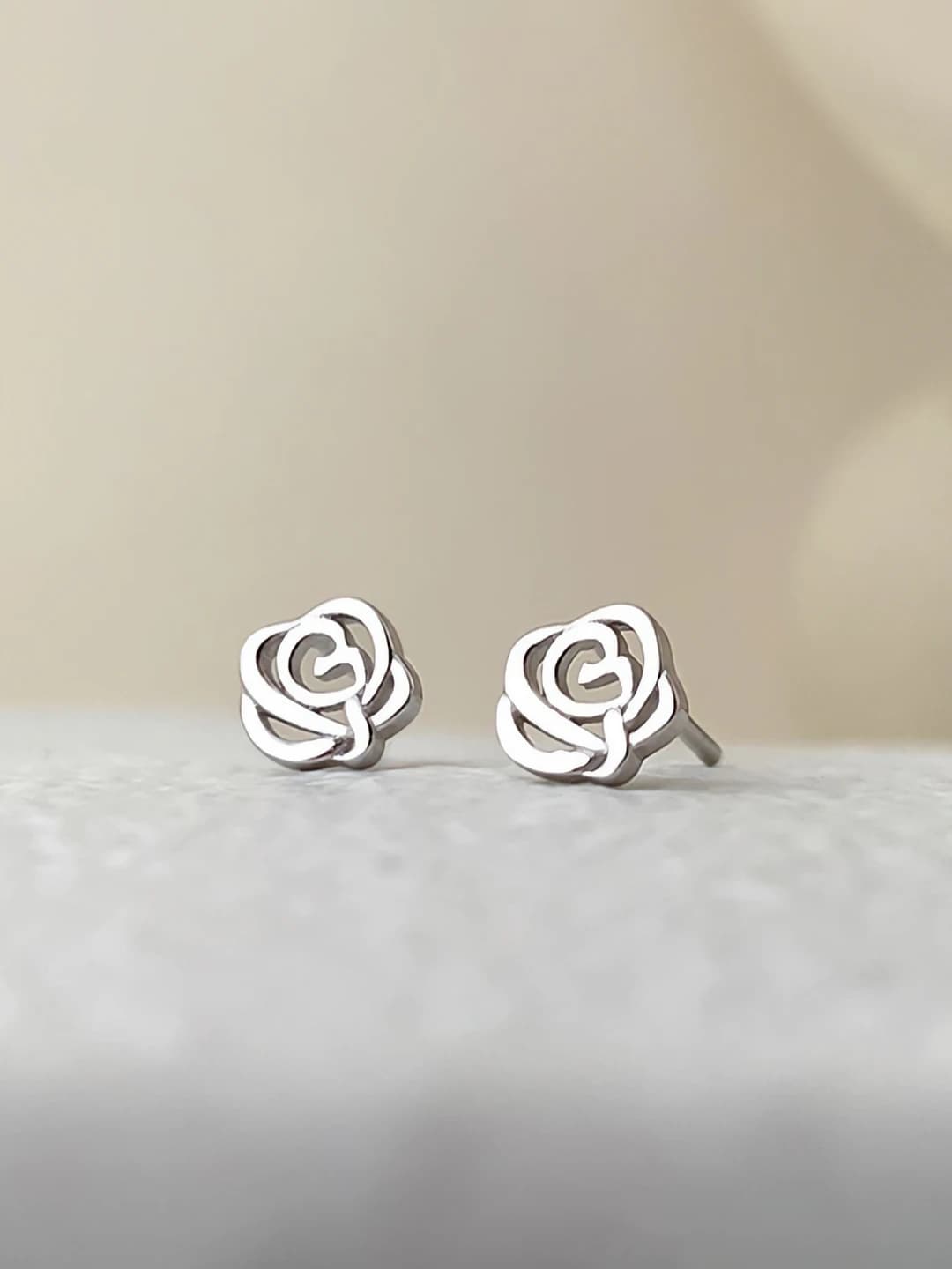 Silver rose studs
