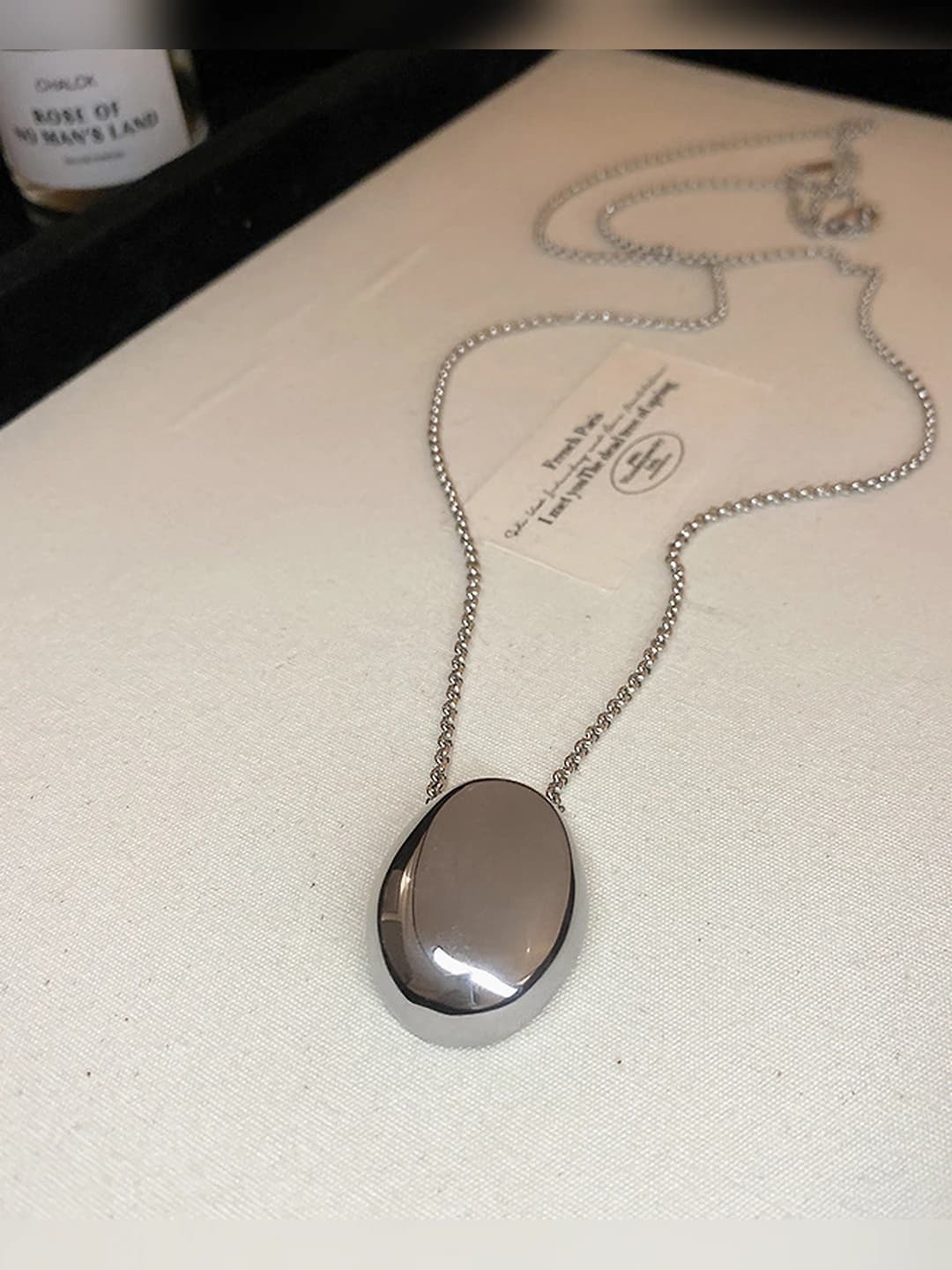 Silver, oval, titanium steel