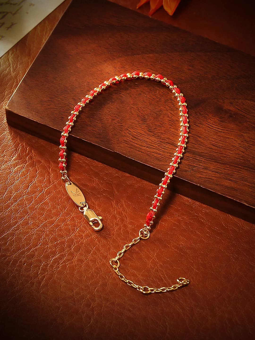 Women's Chinese style bracelet with 18K gold plated copper on red string
