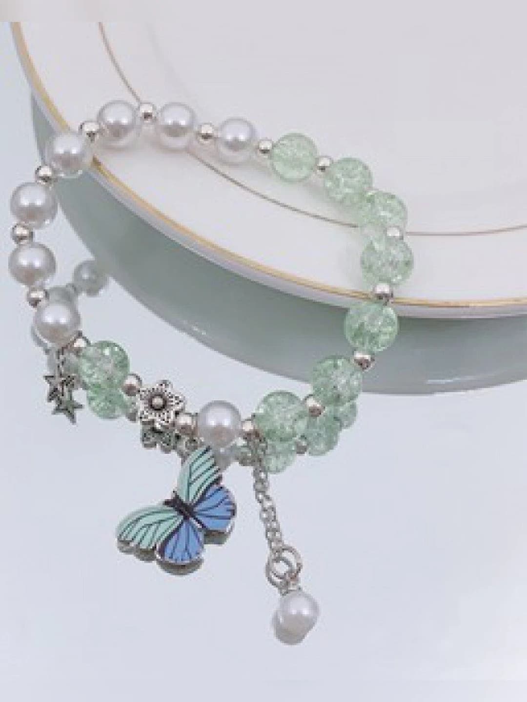 Blue-green butterfly pearl