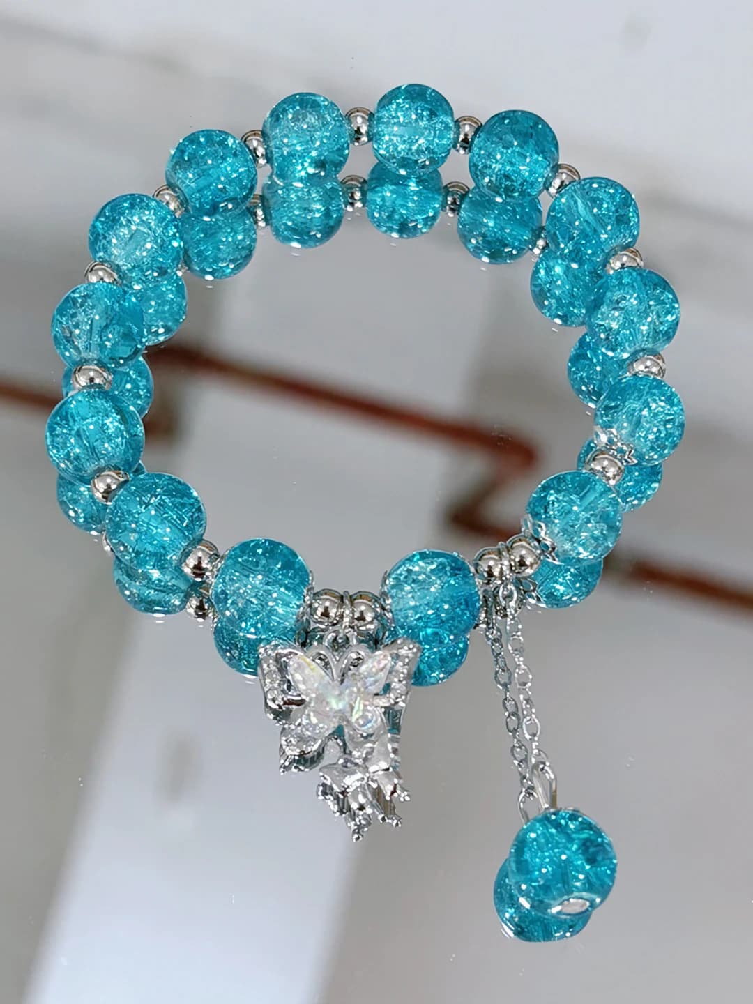 Light blue beaded butterfly bracelet