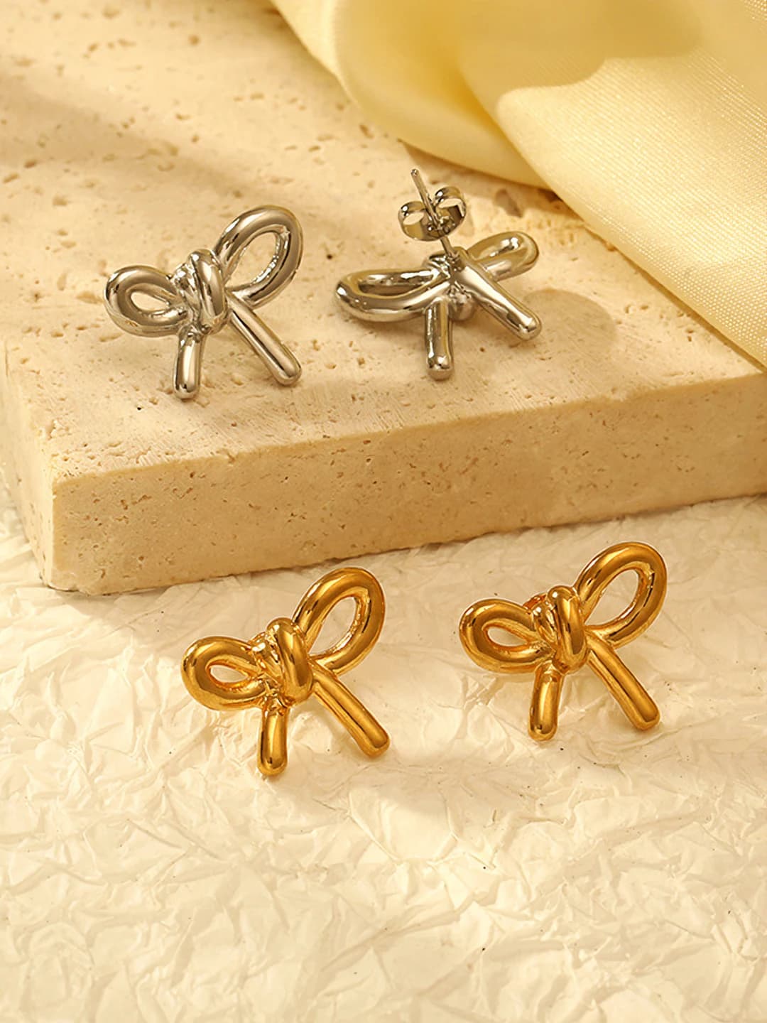 Women's stainless steel bow earrings with 18K gold plating, luxury design