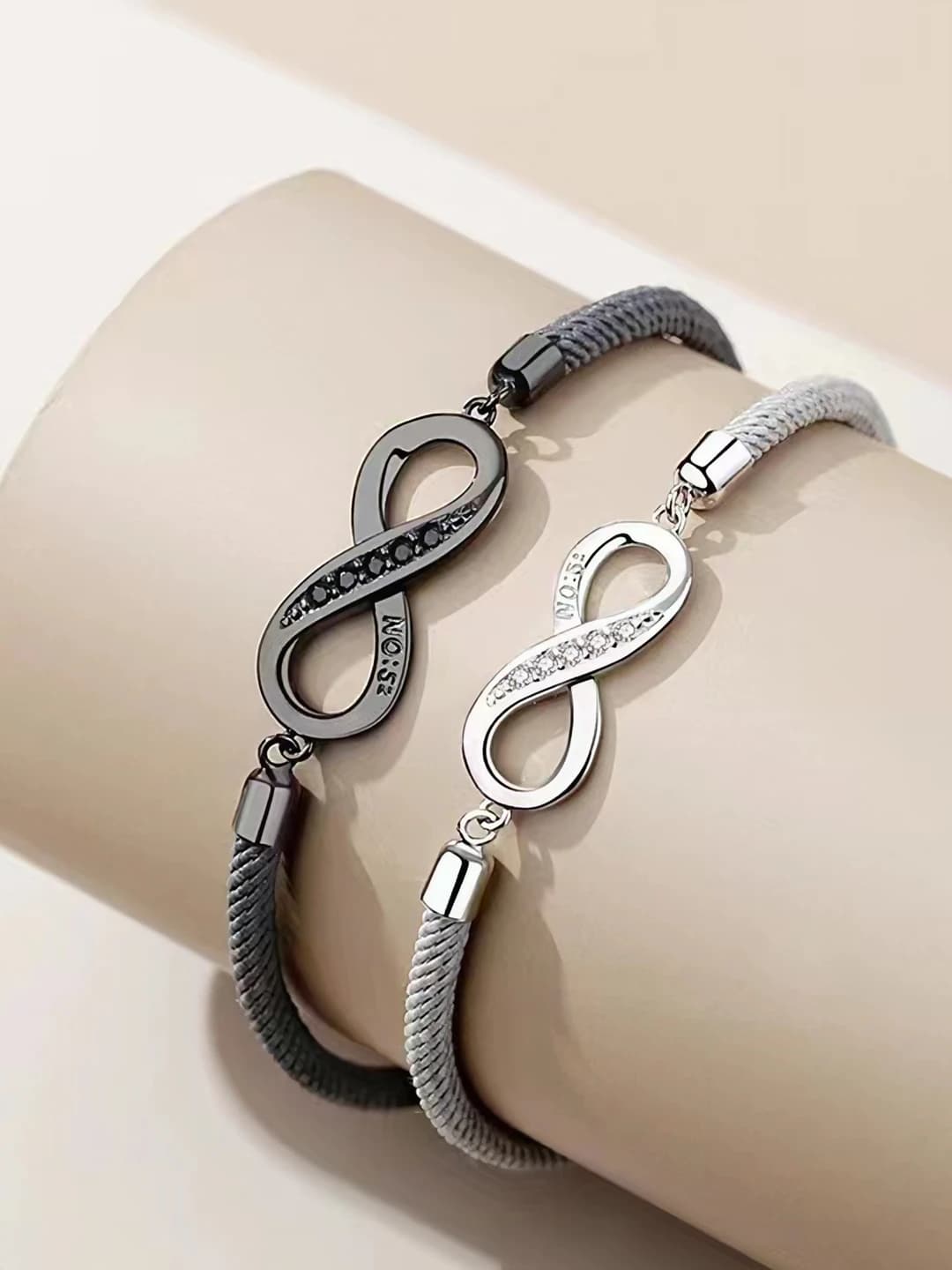 Women's black braided bracelet with Mobius rings and geometric design