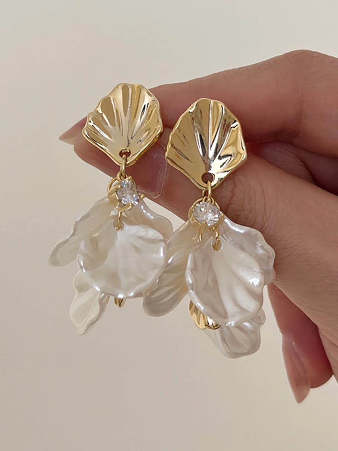 Gold shell petal pendant earrings