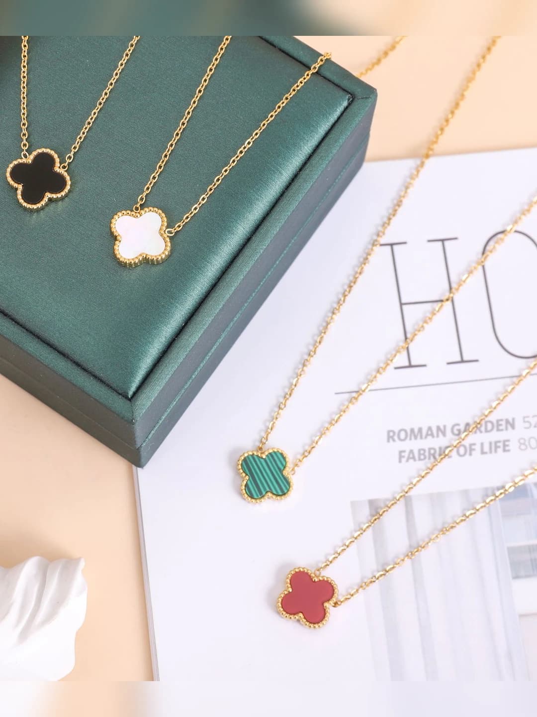 Women's titanium steel set with 18K gold-tone four-leaf clover pendant and chain