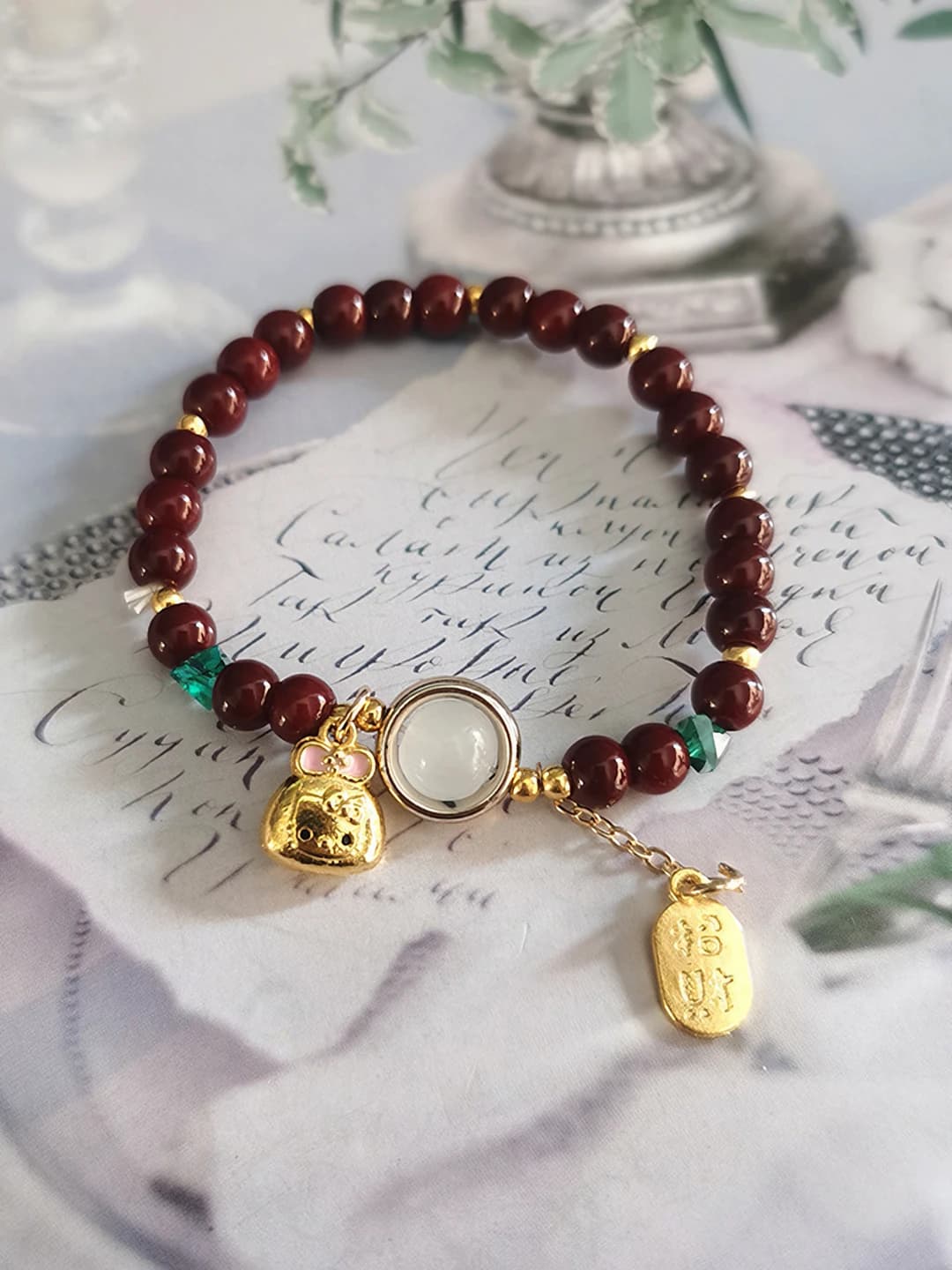Gold-pink KT cat cinnabar bracelet