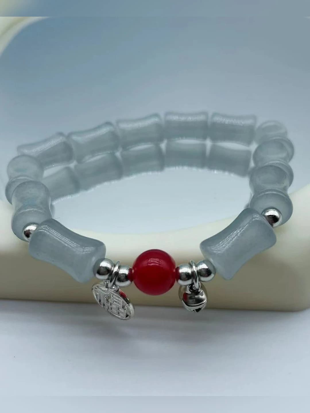 Grey bamboo 'fu' red beads