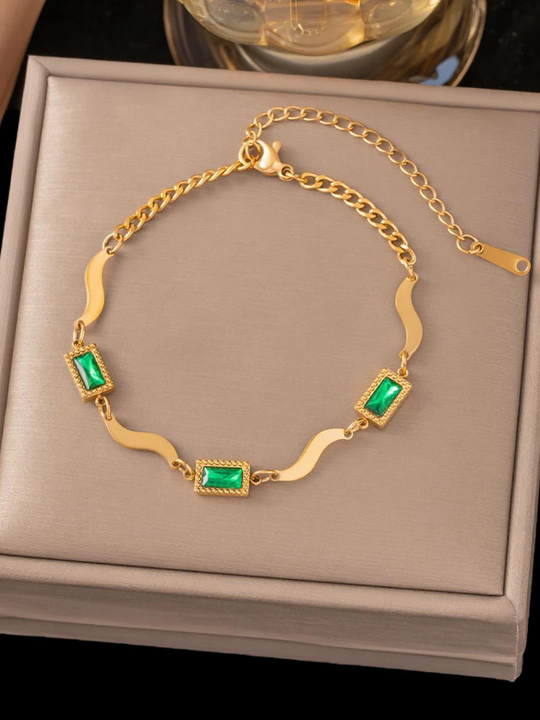 Three green square diamonds, gold