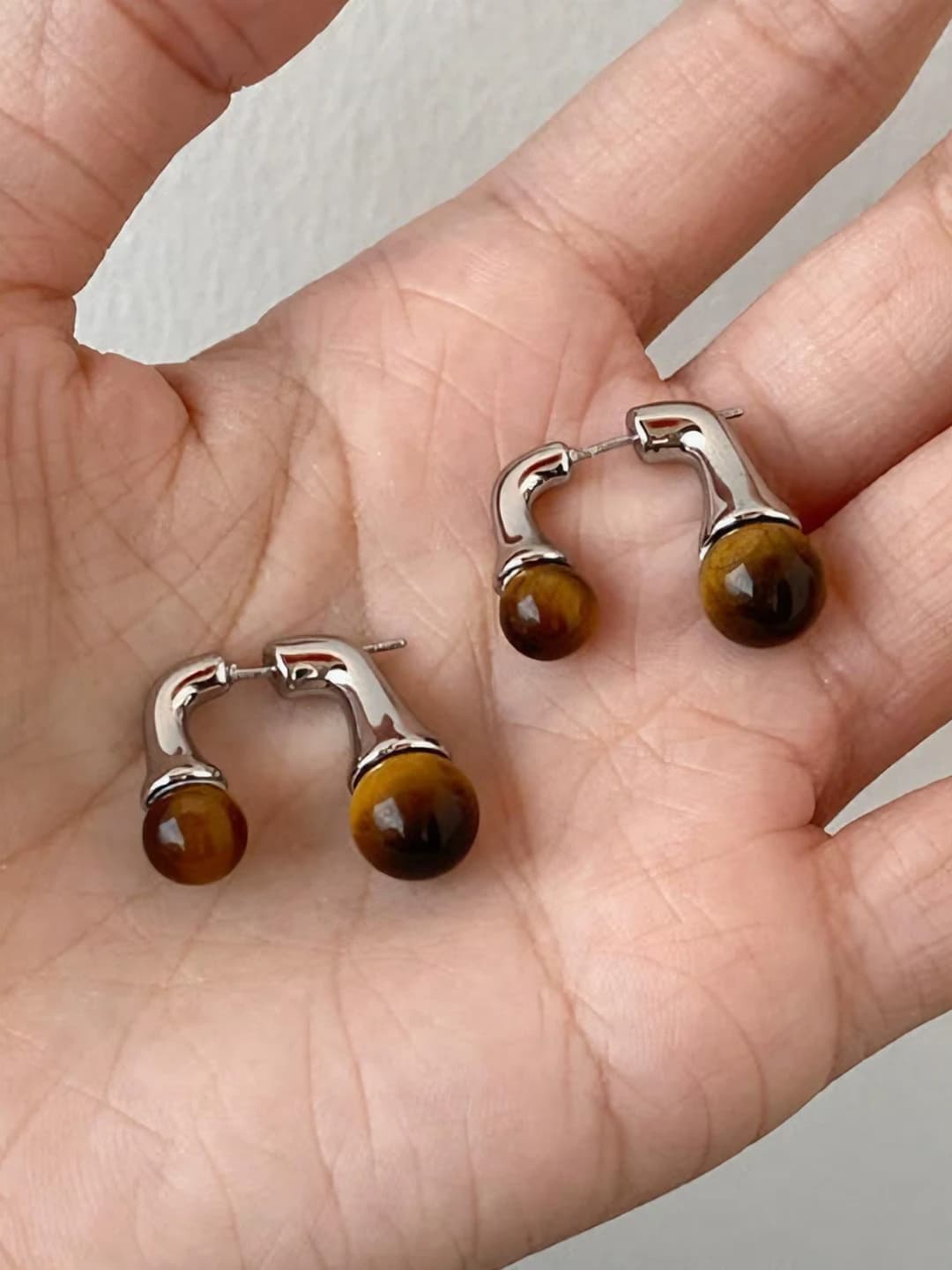 54# Melade tiger eye metal studs