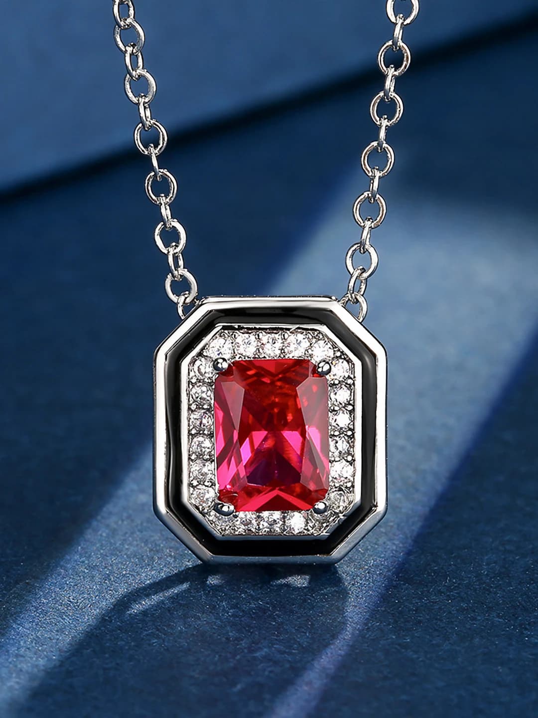 Red ruby pendant with chain