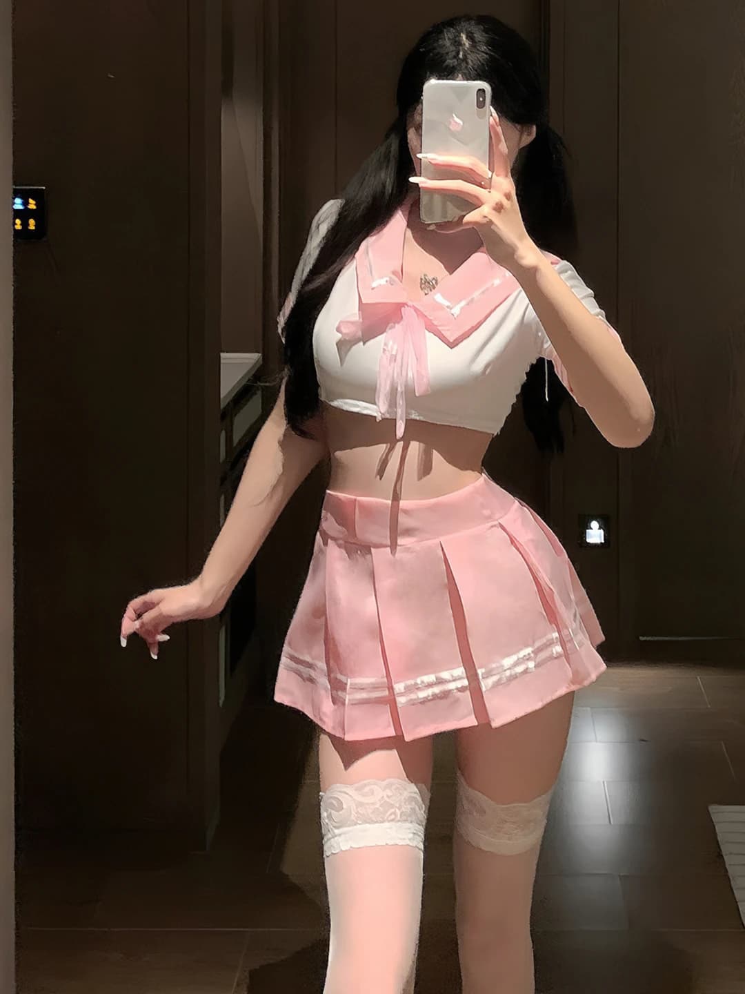 Women's sailor-style set: sleeveless, thin, cropped top and pleated mini skirt