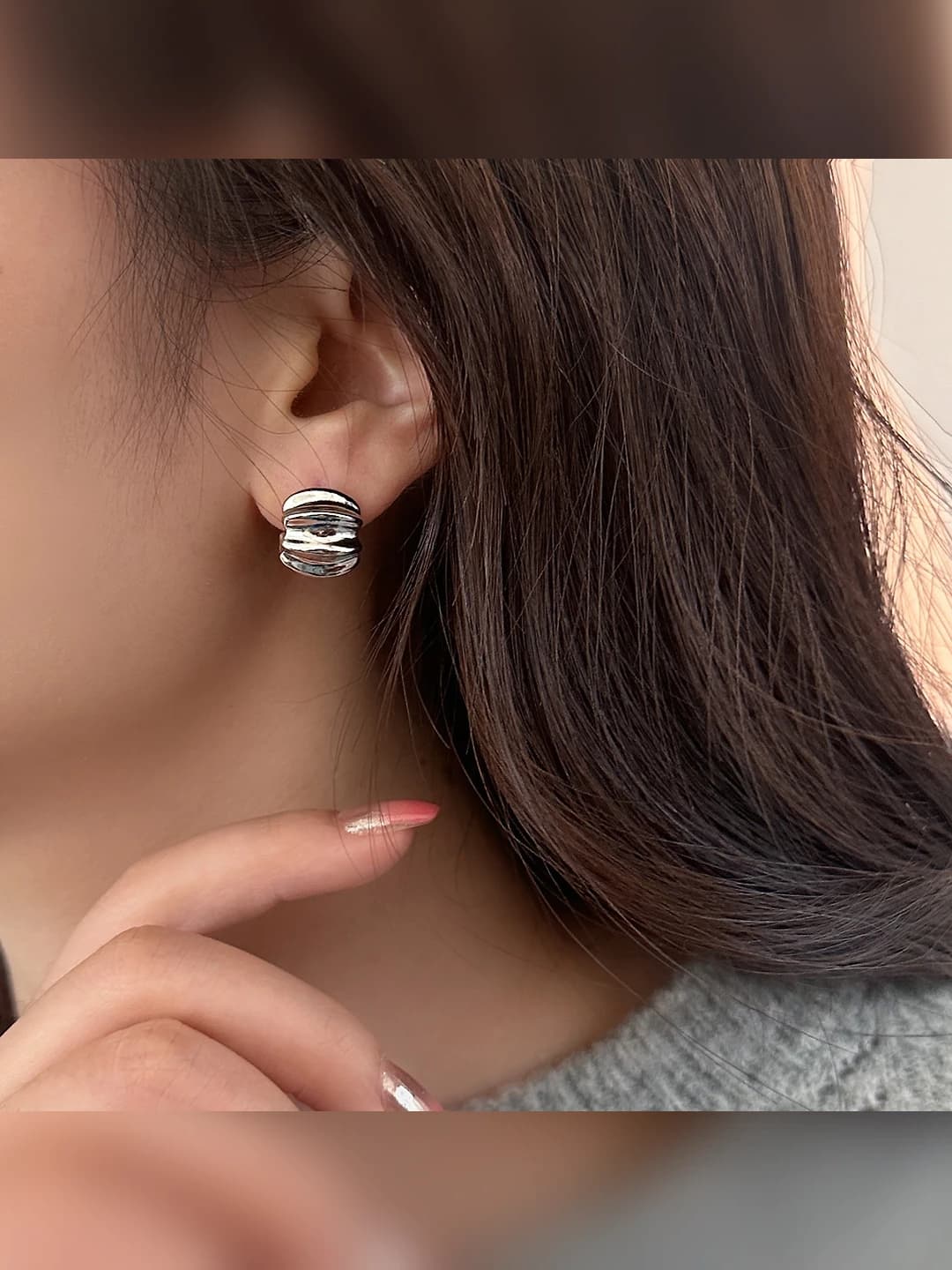 Silver horn-shaped studs, gold plated